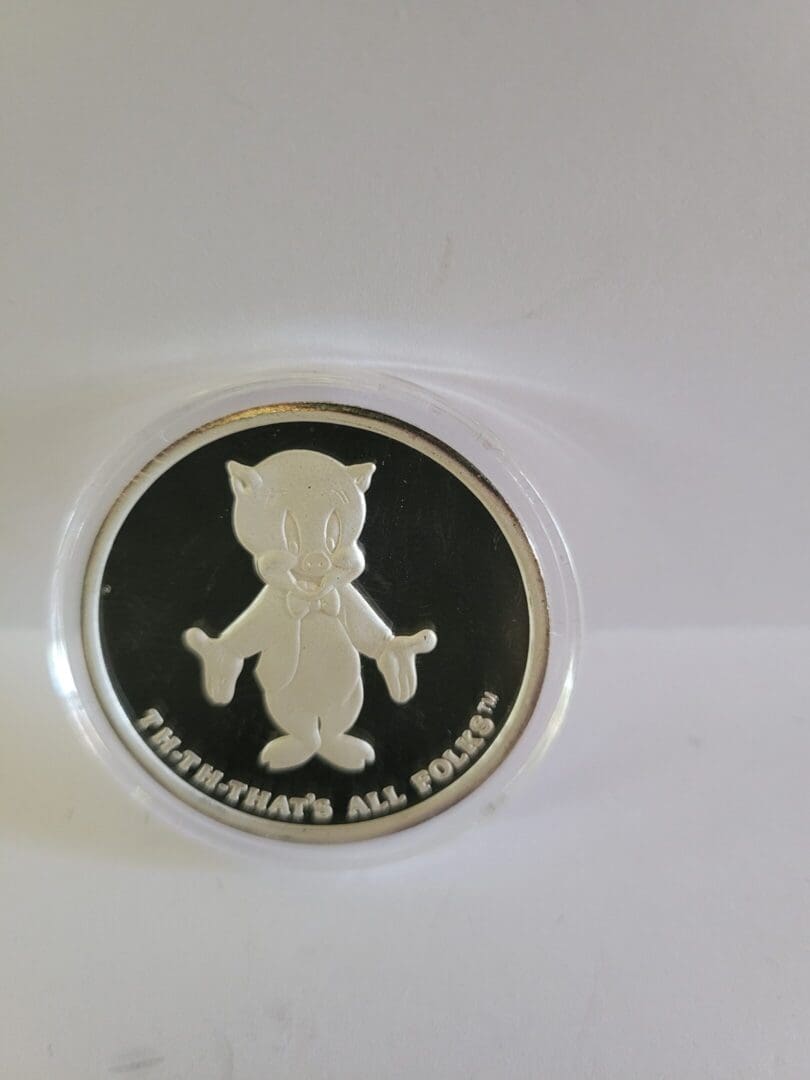 Silver coin with Bugs Bunny image.