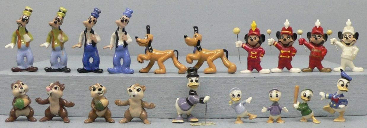 Disney character figurines on display.