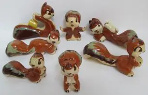 Set of seven ceramic squirrel figurines.