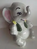 Ceramic elephant figurine wearing a vest.