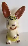 Ceramic bunny figurine with brown ears.