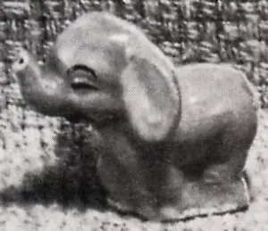 A small, gray elephant figurine.