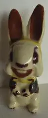 Ceramic bunny figurine with brown ears.