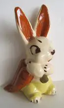 A ceramic bunny figurine with brown ears.