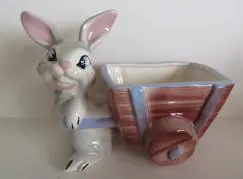 Ceramic bunny pulling a small wagon.