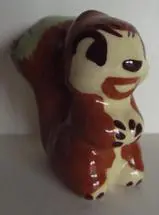 A ceramic figurine of a squirrel.