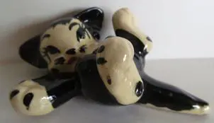 Black and white ceramic kitten figurine.