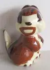 Ceramic figurine of a brown and white squirrel.