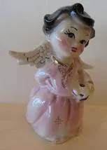 Pink porcelain angel figurine with wings.