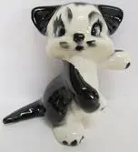 Black and white ceramic kitten figurine.