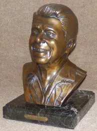 Bronze bust of Ronald Reagan on a marble base.