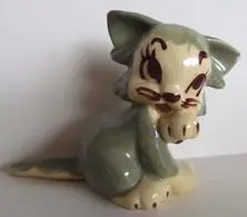 Gray and white ceramic cat figurine.