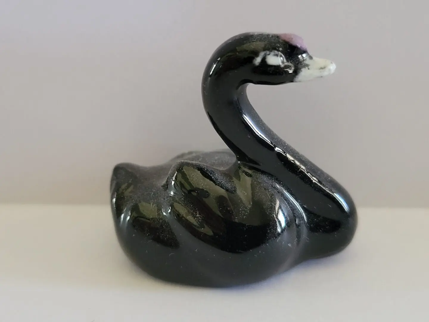 Black porcelain swan figurine.