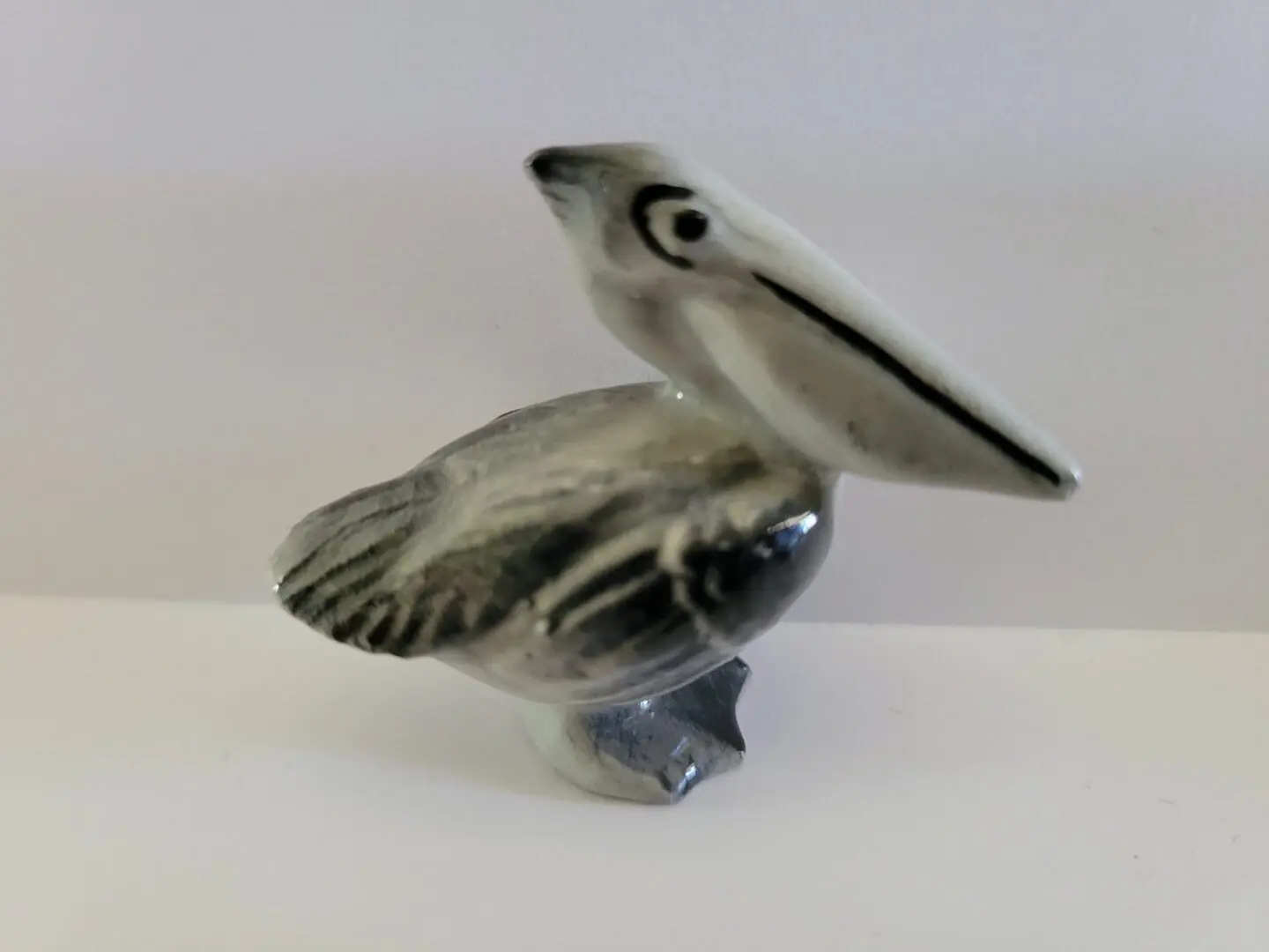 Ceramic figurine of a pelican.