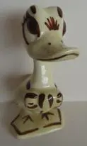 Ceramic figurine of a cartoon duck.