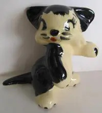 Black and white ceramic kitten figurine.