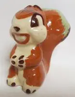 Ceramic figurine of a smiling squirrel.