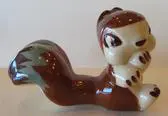 Ceramic squirrel figurine with brown and white glaze.