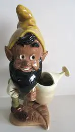 Ceramic gnome holding a watering can.