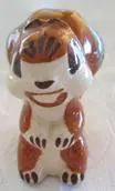 Ceramic figurine of a brown and white dog.