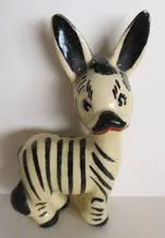 Black and white ceramic zebra figurine.