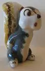 A ceramic figurine of a cartoon squirrel.