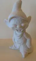 White porcelain figurine of a smiling dwarf.