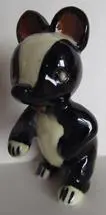 Black and white ceramic badger figurine.