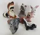 Collection of small ceramic woodland animal figurines.