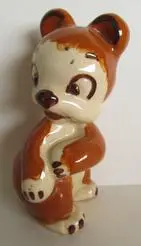 Ceramic figurine of a brown bear cub.