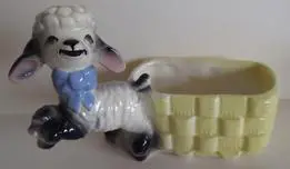 Ceramic lamb planter with yellow basket.