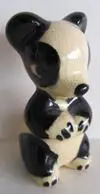 Black and white ceramic panda figurine.