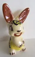 Ceramic figurine of a smiling bunny.