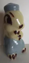 Ceramic figurine of a seated animal.