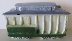 Green and yellow ceramic trolley car.