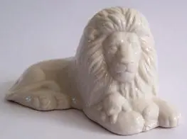 White porcelain figurine of a lion.