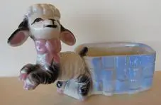 Ceramic lamb planter with blue and white design.