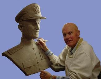 Sculptor working on a clay bust.