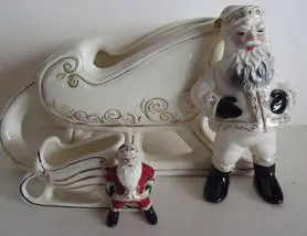 White ceramic Santa and sleigh figurine.