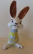 Ceramic bunny figurine with brown ears.