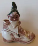 Ceramic gnome figurine in a boot.