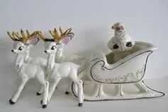 White ceramic Santa sleigh and reindeer.