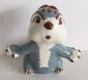 Ceramic figurine of a cartoon squirrel.