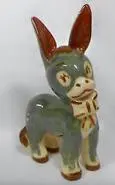 Ceramic donkey figurine with brown ears.