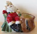 Ceramic Santa Claus planter with sack.