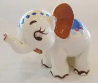 A ceramic figurine of a white elephant.