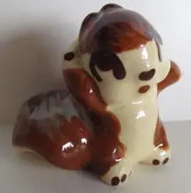 Ceramic figurine of a brown squirrel.