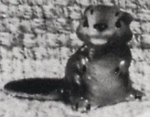 A black and white photo of a squirrel.