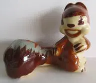 Ceramic figurine of a smiling squirrel.