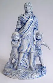 Blue and white ceramic sculpture of Jesus.